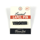 "Virginia" enamel pin in black and silver, mounted on printed backing card.