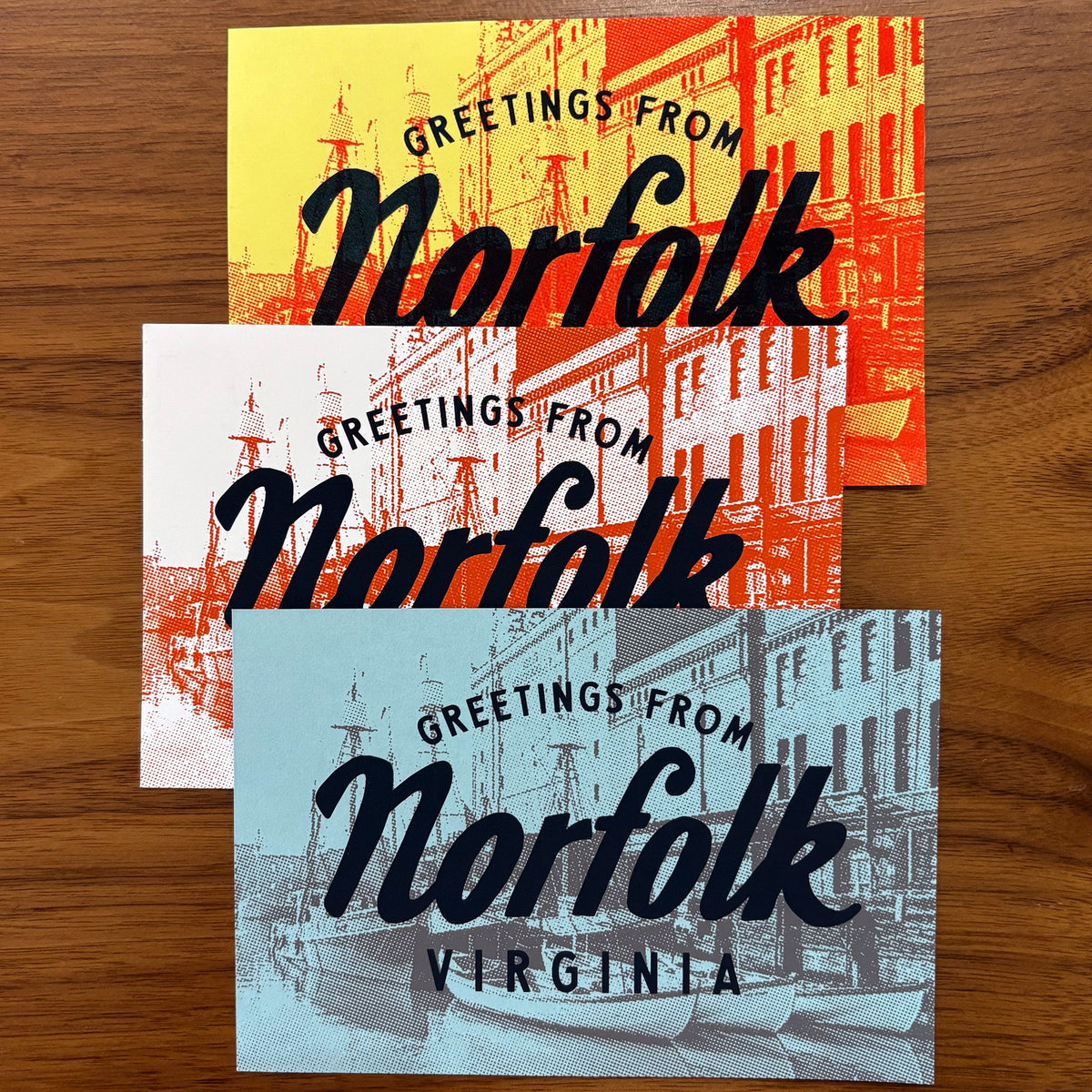 Three postcards "Greetings from Norfolk" in different colors