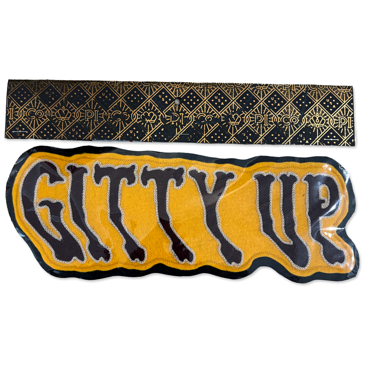 A black and gold patterned fabric headband shown above a matching black and yellow 'GITTY UP' patch on a white background.