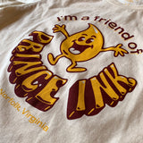 Closeup of t-shirt with yellow and brown retro graphic